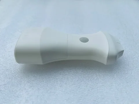 9N斜视实拍,白色沙漏形壳体与灰色电源按键